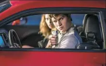  ??  ?? Lily James as Debora and Angsel Elgort as Baby make their getaway in “Baby Driver.”