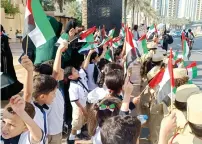  ?? ?? gathered at Mohammed Bin Rashid Boulevard to witness the spectacula­r parade on Tuesday. — supplied photos