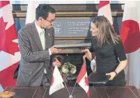  ?? LARS HAGBERG/AFP/GETTY IMAGES ?? Chrystia Freeland and Japanese Foreign Minister Taro Kono signed an agreement believed to be key for Canada-Japan peace.