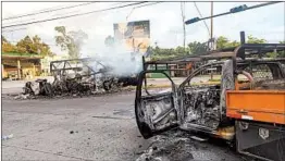  ?? AUGUSTO ZURITA/AP ?? Torched vehicles litter the street a day after Thursday’s gunbattle in Culiacan, Mexico.