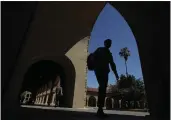  ?? JEFF CHIU — THE ASSOCIATED PRESS FILE ?? People walk on the campus at Stanford University.