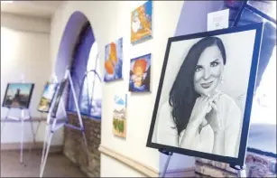  ?? VINCENT OSUNA PHOTO ?? A pencil and charcoal art piece titled “Ellie Burgueno” created by Roberto Romero on display during the city of Calexico’s 110th Anniversar­y Art Exhibit held at the Carmen Durazo Cultural Arts Center on Wednesday in Calexico.