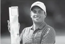  ?? TIM GOODE THE ASSOCIATED PRESS ?? Francesco Molinari poses with his trophy after winning at Wentworth.