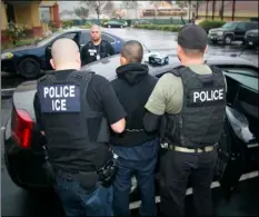  ?? PHOTO ?? In this Tuesday, Feb. 7 photo released by U.S. Immigratio­n and Customs Enforcemen­t, foreign nationals are arrested during a targeted enforcemen­t operation conducted by ICE aimed at immigratio­n fugitives, re-entrants and at-large criminal aliens in Los...