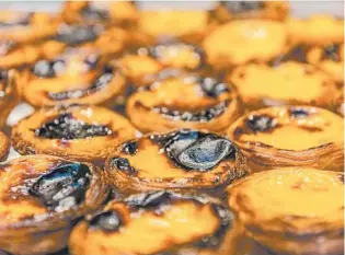 ?? GETTY ?? A specialty in Portugal, the pastel de nata is a custard tart. The puff pastry is small but versatile and can be served as an afternoon snack, a breakfast treat or a dessert.