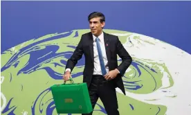  ?? Photograph: Stefan Rousseau/ ?? Looks can be deceiving: Rishi Sunak, then chancellor, holds his ‘Green Box’ ahead of a meeting of finance ministers at the Cop26 summit in Glasgow.