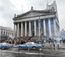  ?? BOBBY CAINA CALVAN / AP ?? Actors playing protesters gather at a New York courthouse Saturday to film a scene in the sequel to “Joker.” Production crews had to wrestle with the possibilit­y of real-life protests over a possible indictment of Donald Trump.