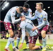  ??  ?? > Jack Grealish is mobbed following his wonder goal against Manchester United