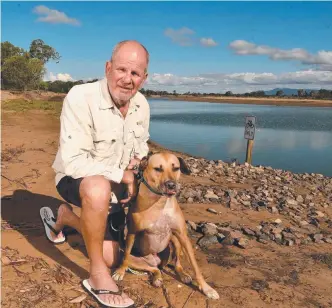  ??  ?? LUCKY DOG: Beach Holm resident Ray Thomson at Black River with his dog Inca who has survived two attacks from the same crocodile (pictured left) which has now been euthanised.