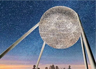  ?? [RENDERING BY JASON KLIMOSKI AND LESLEY CHANG WITH STUDIOKCA] ?? “Taking Flight,” an art centerpiec­e designed for Scissortai­l Park, is designed to allow light to shine through the orb at night, as shown in this rendering showing the view from the hill created in the center of the park.