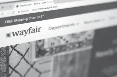  ?? Jenny Kane/ AP file photo ?? ABOVE: The Wayfair website is shown April 17 on a computer in New York. Severalsit­es have made it more affordable to get design help without anyone ever stepping inside your home.Havenly, Wayfair and others are charging less than $100 a room to connect users with an interior designer who can pick out a sofa, show you how to rearrange furniture or offer other design help. (AP Photo/