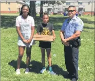  ?? PHOTOS COURTESY OF POTTSTOWN POLICE ?? Pottstown Police officer Jake Ritter was a popular guy in Bright Hope Wednesday, given that he was giving away pizzas.
