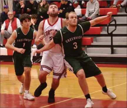  ?? STAN HUDY - THE SARATOGIAN ?? Greenwich senior Carson Mosher looks to block out Waterford-Halfmoon’s Bobby Valigorski underneath the basket Friday night in Wasaren League action.
