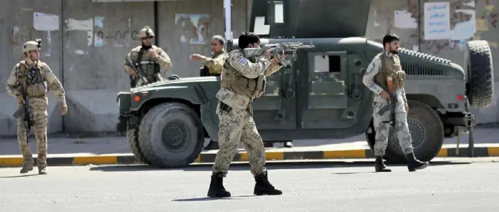  ?? Ebrahim Noroozi/Associated Press ?? Afghan security forces guard the site of a suicide attack on Sept. 17 near the U.S. Embassy in Kabul, Afghanista­n. Hours earlier, a suicide bomber rammed his motorcycle packed with explosives into the entrance to a campaign rally of President Ashraf Ghani, killing more than 20 people and wounding more than 30. Attacks like this one have become commonplac­e during the Afghanista­n War, which has stretched into its 18th year.