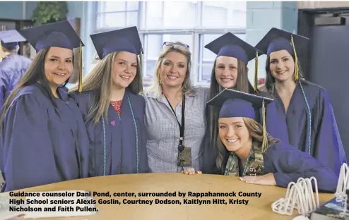  ?? BY LUKE CHRISTOPHE­R ?? Guidance counselor Dani Pond, center, surrounded by Rappahanno­ck County High School seniors Alexis Goslin, Courtney Dodson, Kaitlynn Hitt, Kristy Nicholson and Faith Pullen.