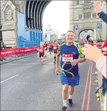  ?? ?? Stephen Fothergill crosses Tower Bridge