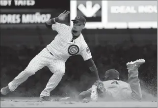  ?? ASSOCIATED PRESS ?? tags out San Diego Padres’ Wil Myers at second during the ninth inning of Saturday’s game in Chicago. The Cubs won 6-5.