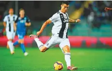  ?? AFP ?? Cristiano Ronaldo shoots and scores for Juventus vs Empoli.