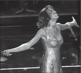  ?? Democrat-Gazette file photo ?? Whitney Houston performs in Los Angeles in 2000.