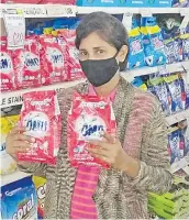  ?? Picture: SUPPLIED ?? Left: Sherin Lata of Naodamu, Labasa with Omo laundry detergent powder at Charan Jeath Singh (CJS) supermarke­t.