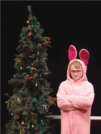  ?? LIZ LAUREN ?? Ralphie (Keegan Gulledge) is none too happy about his Christmas present in “A Christmas Story” at the Marriott Theatre in Lincolnshi­re.