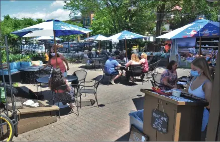  ?? LAUREN HALLIGAN - MEDIANEWS GROUP ?? Saratoga Springs restaurant Bailey’s offers patio dining on Thursday, June 4, the first day Capital Region restaurant­s were permitted to offer outdoor dining as part of the state’s reopening process.