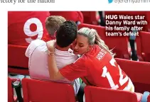  ?? ?? HUG Wales star Danny Ward with his family after team’s defeat