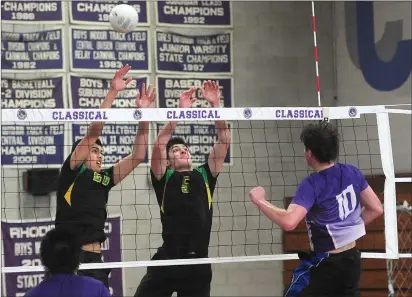  ?? Photo by Ernest A. Brown ?? North Smithfield middle hitter Tejas Bhatia (left) and outside hitter Tyler Cook (5) attempt to block Classical middle Oliver Rayner (10) during the No. 2 Purple’s four-game victory over the No. 7 Northmen Friday afternoon.