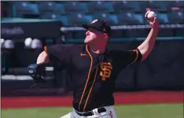  ?? CARMEN MANDATO — GETTY IMAGES, FILE ?? The Giants’ Jake McGee delivers during a spring game against the White Sox on March 4.