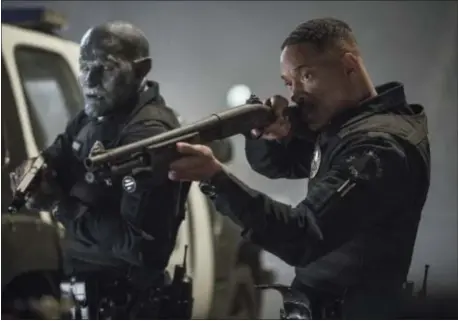  ?? ASSOCIATED PRESS ?? This image released by Netflix shows Will Smith, right, and Joel Edgerton in a scene from, “Bright.”