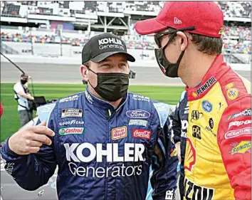  ?? JOHN RAOUX / AP ?? Ryan Newman, left, and Joey Logano talk on pit road before the Daytona 500 on Feb. 14.