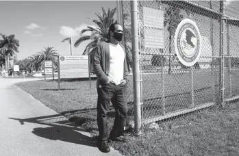  ?? MARTA LAVANDIER/AP ?? Kareen Troitino stands near the Federal Correction­s Institutio­n last week in Miami. Troitino, a local correction’s officer union president, said fewer than half of the facility’s 240 employees have been fully vaccinated as of March 11.