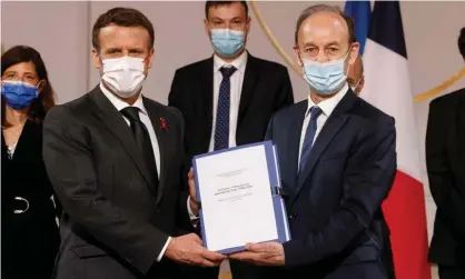  ?? Photograph: Ludovic Marin/AFP/Getty Images ?? The 1,200-page report is presented to Macron on Friday by the historian Vincent Duclert, right.