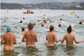  ?? Photograph: Lisa Maree Williams/Getty Images ?? ‘How amazing is this?’ … The annual Sydney Skinny event, held at Cobblers Beach on Sydney Harbour, drew more than 1,000 eager to take a nude swim.