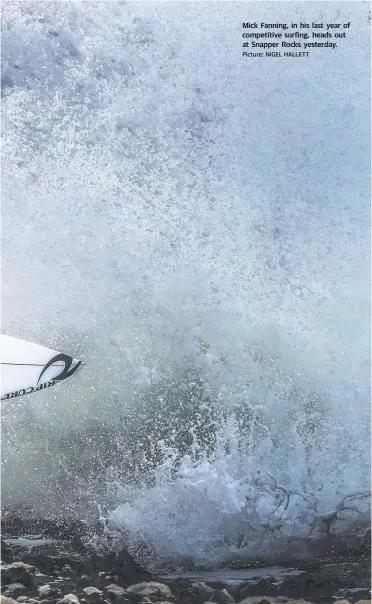  ?? Picture: NIGEL HALLETT ?? Mick Fanning, in his last year of competitiv­e surfing, heads out at Snapper Rocks yesterday.