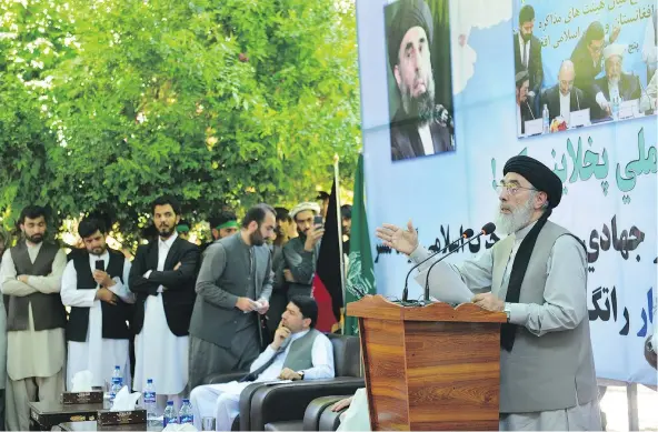  ??  ?? Gulbuddin Hekmatyar gives a speech in Mehtarlam city in Afghanista­n on Saturday. The fugitive Afghan warlord who battled U.S. forces after the 2001 invasion and nursed bitter rivalries with other militant factions now says he wants peace in Afghanista­n. — AP PHOTO