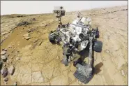  ?? NASAVIA REUTERS ?? NASA's rover Curiosity, seen in this February 3, 2013, selfportra­it, is exploring the red planet, searching for evidence of what the planet was like in the past.