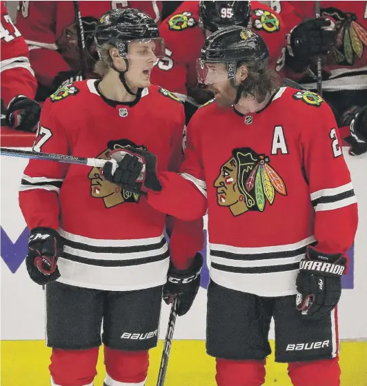  ?? NAM Y. HUH/AP ?? Blackhawks defensemen Adam Boqvist (left) and Duncan Keith will have to do a better job against Oilers stars Connor McDavid and Leon Draisaitl.