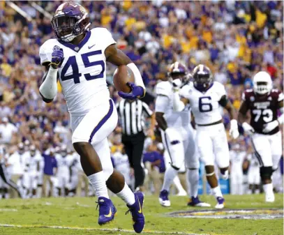  ?? JONATHAN BACHMAN/GETTY IMAGES ?? Michael Divinity Jr. sets up LSU’s lone touchdown with an intercepti­on early in the first quarter.
