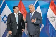  ?? AP/SEBASTIAN SCHEINER ?? Paraguayan President Horacio Cartes (left) appeared with Israeli Prime Minister Benjamin Netanyahu on Sunday to open Paraguay’s new embassy in Jerusalem.