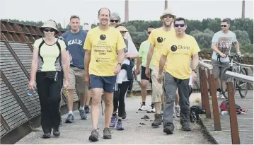  ??  ?? Shine chairman, Richard Astle and friends during their 50 mile charity walk Photo: David Lowndes