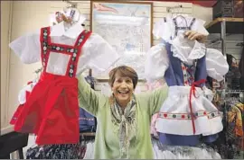  ?? Myung J. Chun Los Angeles Times ?? STORE owner Sue Manning joked that Greenland would be a good cold-weather market for wool clothing. Her Solvang shop sells handmade Danish costumes.