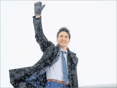  ?? CP PHOTO ?? Prime Minister Justin Trudeau waves as he boards the government airplane on his way to Chicago, in Ottawa Wednesday.