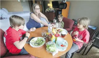  ?? JOHN MAHONEY / MONTREAL GAZETTE ?? Frances Maxant, her husband and four sons have been living in a hotel since their home on 5th Ave. in Roxboro was flooded in the spring. “The way everything is being handled now is a disaster,” says Maxant, with sons Radek, left, Marek and Lukas Korda...
