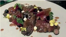  ?? JANAN JAY ?? A thinly sliced venison carpaccio with smoked yoghurt, blueberry and beet.