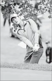  ?? CHRIS TILLEY / ASSOCIATED PRESS ?? Danny Lee watches his chip shot onto the eighth green during the second round of the Greenbrier Classic on Friday.