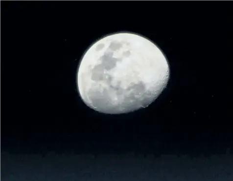  ?? NASA/RANDY BRESNIK/GETTY IMAGES ?? This NASA handout image of the Moon, was taken from his vantage point in low Earth orbit aboard the Internatio­nal Space Station, by NASA astronaut Randy Bresnik as he pointed his camera and captured this image on Aug. 3. North America’s first full...