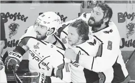  ?? ETHAN MILLER GETTY IMAGES ?? Chandler Stephenson, Nicklas Backstrom and Alex Ovechkin of the Washington Capitals watch the final seconds tick away to their team’s first ever Stanley Cup victory.