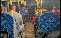  ?? ?? Floodwater surged on board this bus returning from the cancelled Elton John concert on Friday night.