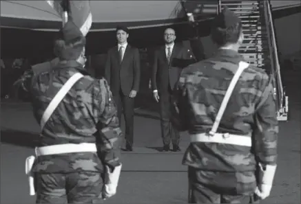  ?? SEAN KILPATRICK, THE CANADIAN PRESS ?? Prime Minister Justin Trudeau is greeted by Belgium Prime Minister Charles Michel as he arrives in Brussels, Belgium on Wednesday to attend the NATO summit. Canada will likely be asked to spend more on defence.